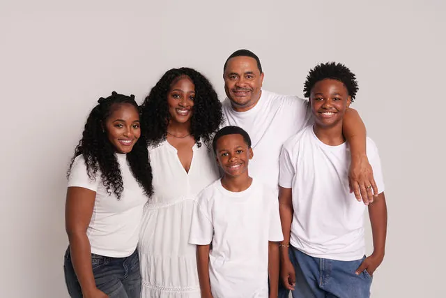 Houston family portrait in coordinated white attire